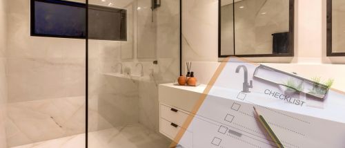 Modern bathroom background overlaid with a clipboard checklist and pen, symbolising early planning and preparation for a bathroom renovation.